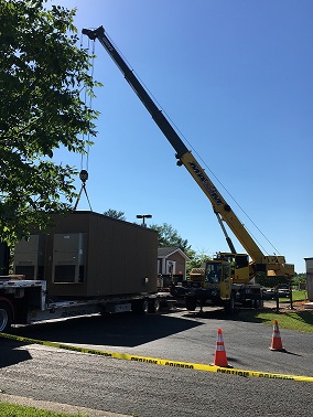 Crane moving the Hut.